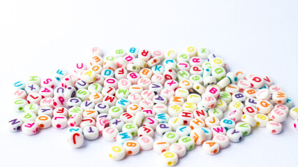 Collection of colourful beads blocks to make handmade jewellery bracelet names. heap of multi...