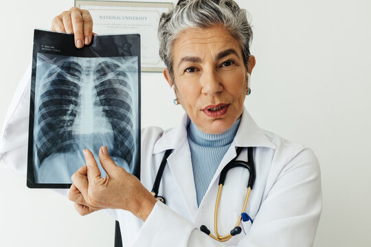 Radiology and telemedicine: Doctor explains an x-ray image in a video conference