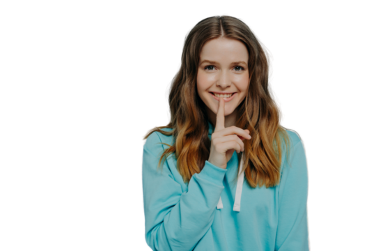 Cute female teenager demonstrating shushing sign