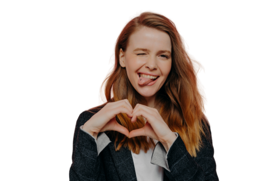 Happy excited young woman showing heart shape sign