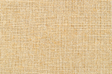 The Color photo of the texture of a brown burlap potato sack.