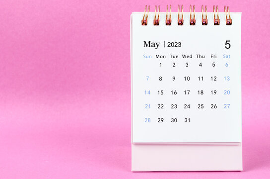 A May 2023 Desk Calendar On Pink Color Background.