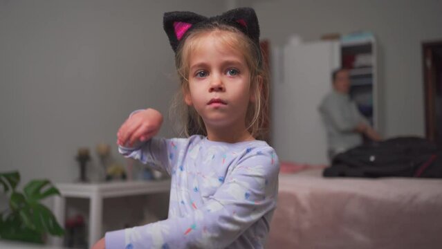 Crazy child dancing at home funny moving Going Mad and Emotional Little Girl. Young Funny Girl Yelling Screaming. Child Scream Loudly. Attention Deficit Hyperactivity Disorder.