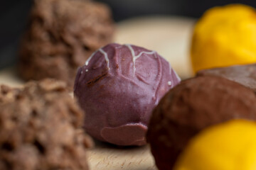Chocolate purple sweet candy in the shape of a ball
