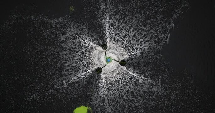 Waste Water Turbine Use Treatment Wastes Water Increases Oxygen By Motor Electric Energy For Return aerial view camera up movement from drone. 4k video