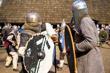 Unidentified participants at medieval fight during of international historical festival of VIKING...