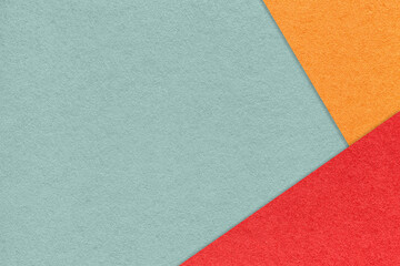 Fototapeta premium Texture of craft pastel green color paper background with red and orange border. Gray cardboard. Presentation template