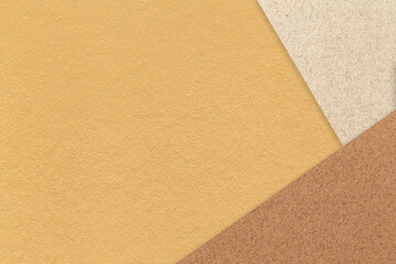 Fototapeta premium Texture of craft yellow color paper background with beige and brown border. Vintage abstract ocher cardboard.