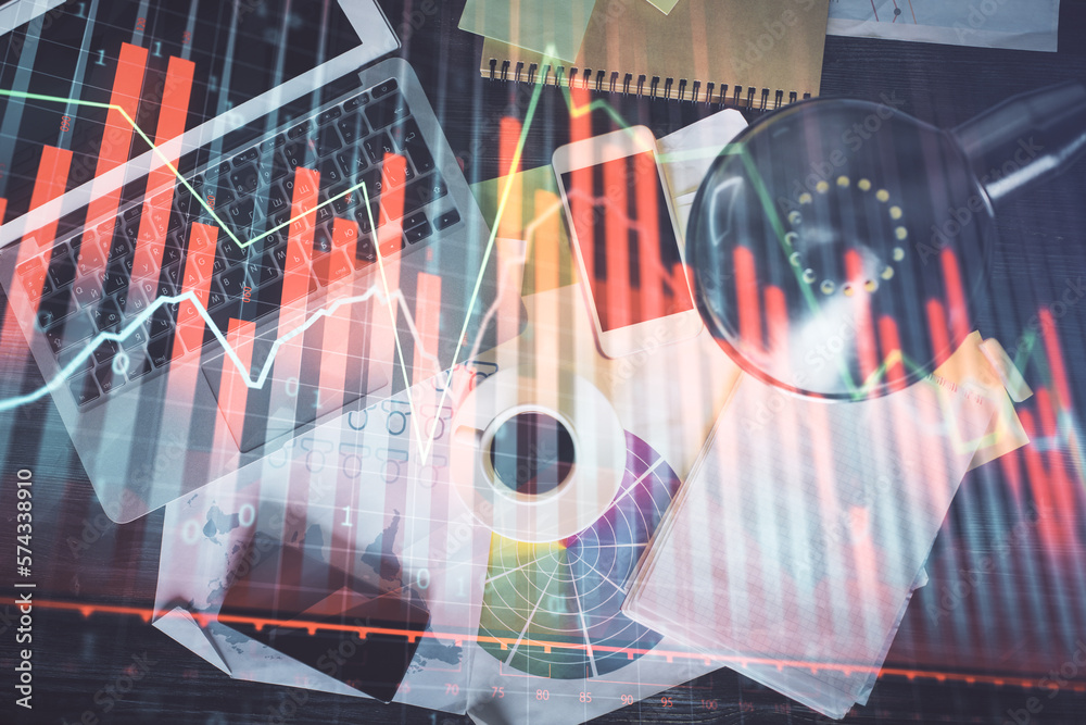 Poster financial market graph and top view computer on the desktop background. multi exposure. investment c