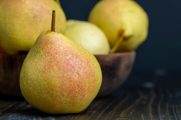 harvested sweet ripe pear in drops of water