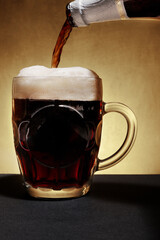 mug with dark beer and foam