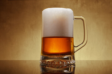 mug with light beer and foam