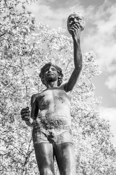 The Mask Seller statue by Zacharie Astruc in the Luxembourg garden in Paris, France in black and white