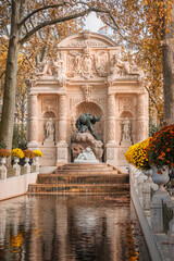 Fototapeta na wymiar The Medici Fountain in the Jardin du Luxembourg garden in Paris, France a day of Fall