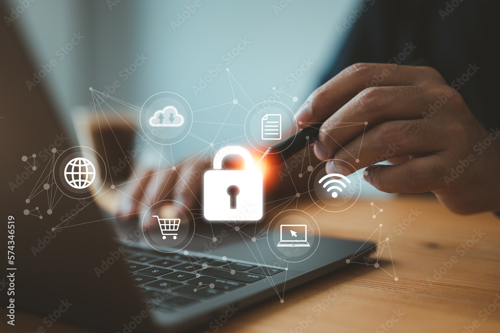 Poster businessman using his laptop to establish a network connection that is protected by a shield guard, which safeguards against cyber attacks. This exemplifies the concept of network security systems.