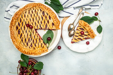 Delicious Homemade Cherry Pie, Flaky Crust, piece on a plate and the whole homemade cherry pie. top view