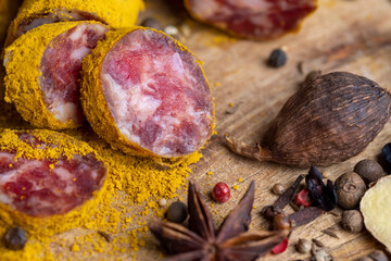 Sliced veal salami with turmeric