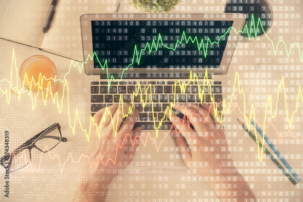 Poster double exposure of man's hands typing over laptop keyboard and forex chart hologram drawing. top vie