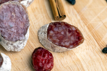 Chunks of sliced sausage with white mold