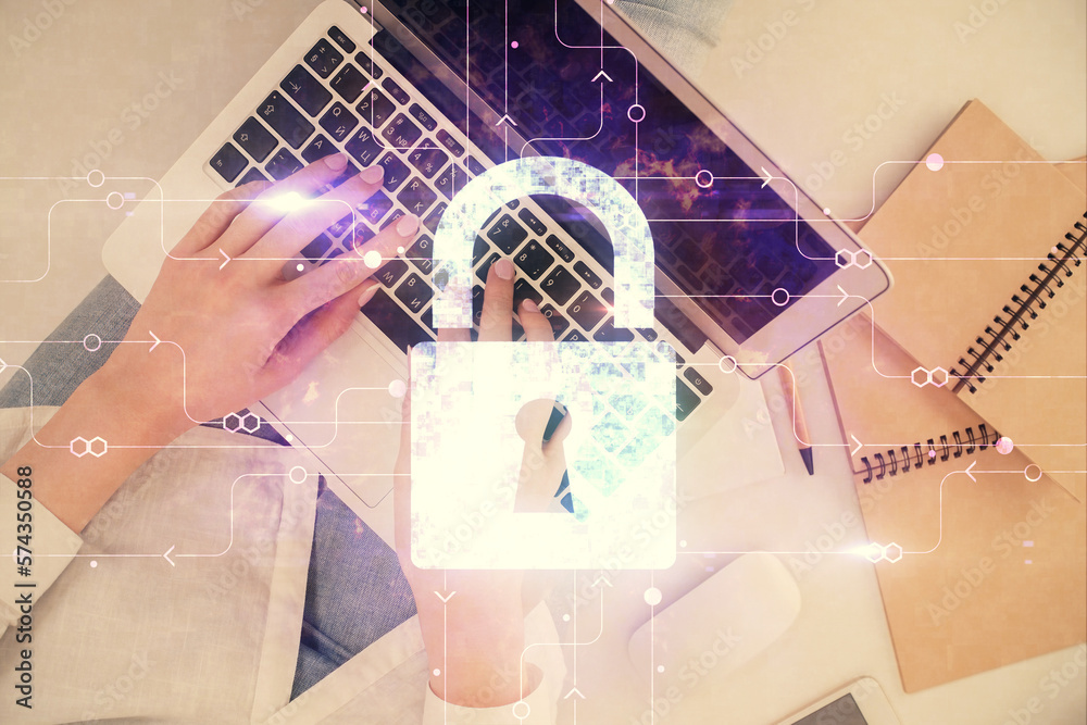Poster double exposure of woman hands working on computer and lock hologram drawing. top view. security con