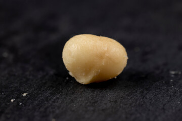 Peeled macadamia nuts on the table