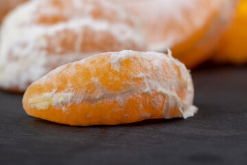 Peeled tangerines on the table, close up