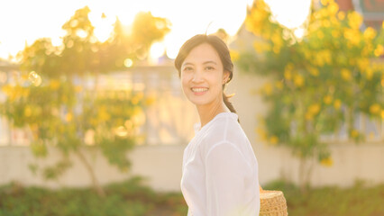 Portrait young beautiful asian woman with happy smile around outdoor park in sunny summer day