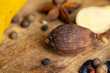 A whole nutmeg fruit on the kitchen table