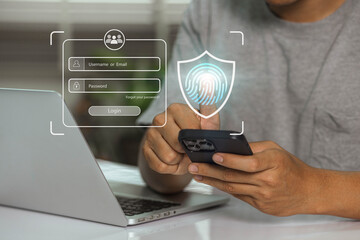 User uses fingerprint for log in for privacy and security of personal data. Cyber security protects business transactions from online cyberattacks