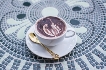 Coffee cappuccino on  table with nature background