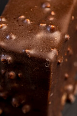 Fresh sweet cake with milk taste and aroma in chocolate glaze
