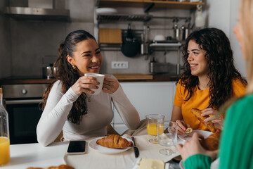 Friends are having coffee and pastry over a nice conversation