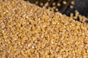 Fresh wheat porridge but cooked scattered on the table