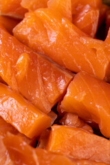 Sliced red trout meat with sea salt