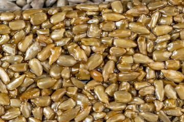 Fried sunflower seeds with sweet molasses from sugar beet