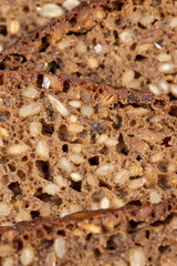 Black rye bread cut into chunks with sunflower seeds