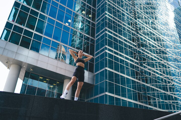 Muscular woman chilling in city