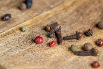 Different types of spices scattered on the table during cooking