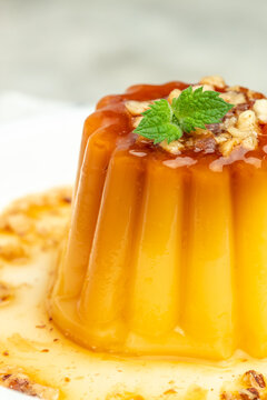 panna cota with caramel. Creme Caramel Dessert on a light background. vertical image. place for text