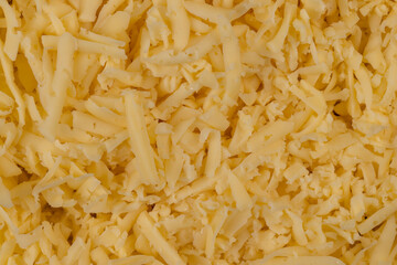 Hard cheese with holes grated into thin small slices