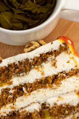 a cut piece of multi-layered honey cake with creamy filling
