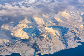 Aerial view of frozen mountains and rivers in the North Pole