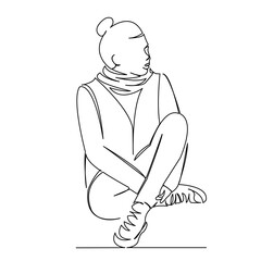 girl in sneakers sitting on the floor