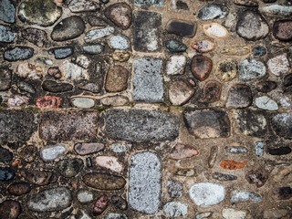 imagen detalle textura suelo de piedras de distintos tamaños con las juntas de cemento 