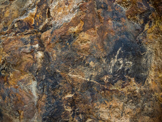 imagen detalle textura piedra con distintos colores negros y marrones con distintas profundidades 