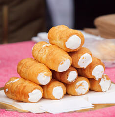 Kremrole - local traditional dessert, or cream horn, sort of Danish pastry with cream, sold by local bakery at Naplavka farmers street food market. Prague, Czech Republic