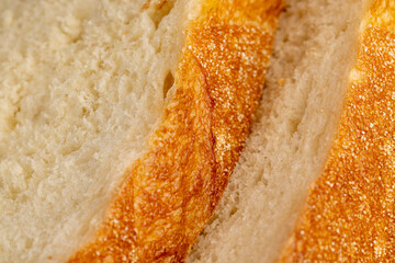 A cut loaf of round-shaped wheat bread