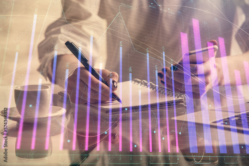 Poster double exposure of financial graph sketch hologram and woman holding and using a mobile device. stoc