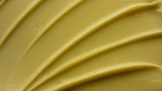 Crane macro shot of yellow anti-aging cream with coenzyme Q10 | Anti-aging cream background for its commercial