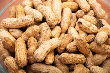 Peanuts in shell isolated on white background. Heap of peanuts close up	